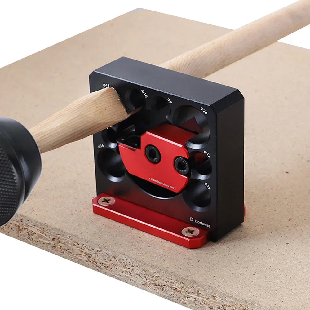 Red and black woodworking dowel jig with marked hole sizes for precise drilling on wood