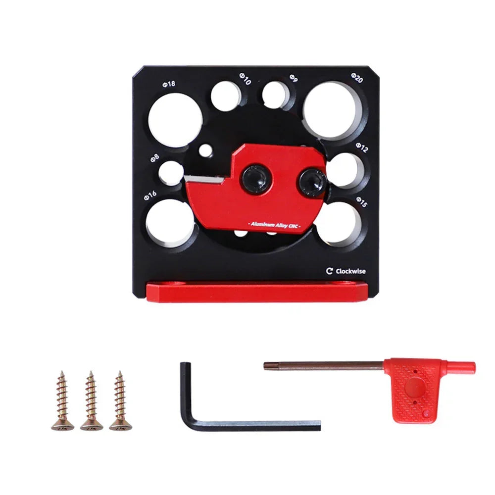 Black and red woodworking dowel jig with drill guide holes, screws, and hex keys for precise joinery projects