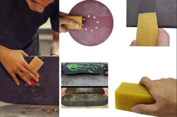 Woodworker sanding skateboard deck with yellow sanding block, showing grit texture and dust particles.
