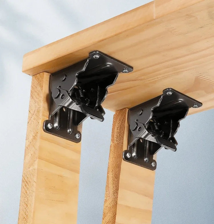 Black metal table brackets securing wooden tabletop to legs for sturdy woodworking projects